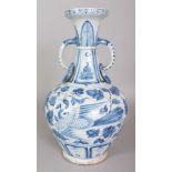 A CHINESE YUAN STYLE BLUE & WHITE PORCELAIN PHOENIX VASE, with moulded animal-head and ring handles,