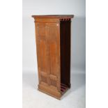 AN OAK CABINET WITH FOUR TABLE LEAVES. 4ft 11ins high x 5ft 9ins wide.