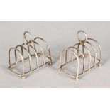 A PAIR OF SMALL FOUR DIVISION TOAST RACKS. Maker: JBC & S. Birmingham 1927. 2.75ins long.