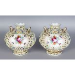 A PAIR OF NORITAKE BULBOUS VASES, painted in enamels with flowers in pink (not marked). 6ins high.