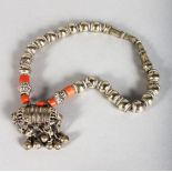 A SILVER AND CORAL ISLAMIC NECLACE.