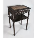 A CHINESE CARVED WOOD MARBLE TOP RECTANGULAR TABLE. 2ft 8ins high x 1ft 9ins long x 1ft 4ins deep.