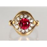 A 9CT GOLD, DIAMOND AND RUBY DRESS RING.