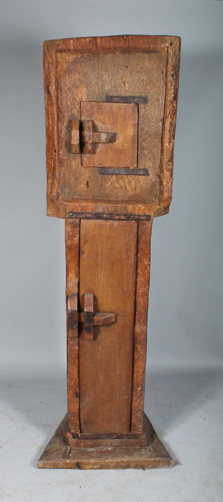 CARVED OUT OF THE SOLID. AN UNUSUAL TALL STANDING CUPBOARD, with two panel doors. 6ft high x 1ft - Image 2 of 3