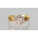 A GOLD CLUSTER RING.