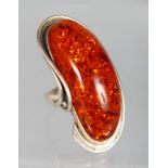 A SILVER AMBER RING.