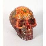A CARVED AMBER SKULL. 5.5ins high.