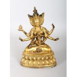 A GILT TIBETAN BRONZE MULTI ARM DEITY. 8ins high.