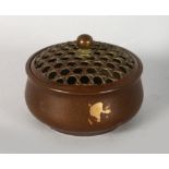 A CHINESE BRONZE GOLD SPLASH CENSER AND COVER, stamped to the base. 3ins diameter.