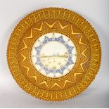A SUPERB INDIAN PAINTED CIRCULAR IVORY PANEL, Indian equestrian soldiers, 7.5ins diameter, in a