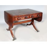 A REGENCY MAHOGANY SOFA TABLE, with crossbanded top, folding flap, two frieze drawers with turned