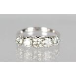 AN 18CT WHITE GOLD FIVE STONE GRADUATED DIAMOND RING of 1.2CTS.