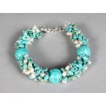 A SILVER TURQUOISE BRACELET.