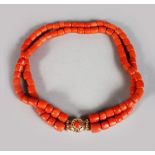 A VERY GOOD DOUBLE ROW CORAL NECKLACE with gold clasp, 96gms.