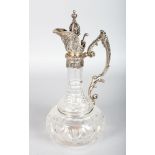 A GOOD CONTINENTAL SILVER AND GLASS CLARET JUG.