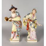 A PAIR OF CONTINENTAL PORCELAIN ORIENTAL FIGURES OF A MAN AND WOMAN, wearing flowing robes. 14ins