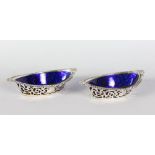 A PAIR OF OVAL PIERCED BONBON DISHES with sapphire blue liners. Birmingham 1905.