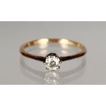 A 9CT GOLD AND DIAMOND SOLITAIRE RING.