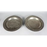 A PAIR OF LARGE 18TH CENTURY PEWTER DISHES. 14ins diameter.