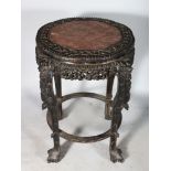 A GOOD 19TH CENTURY CHINESE CARVED HARDWOOD PLANT-VASE STAND, with inset marble top on four legs.