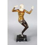 AN ART DECO STYLE GILT BRONZE AND BONE DANCER, on a marble base. 16ins high.