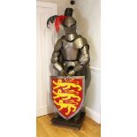 A GOOD COMPOSITE FULL SUIT OF ARMOUR, complete with shield and sword, 20th century. 6ft 0ins high.