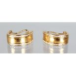 A PAIR OF 18CT GOLD AND DIAMOND EARRINGS.