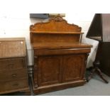 AN UNUSUAL VICTORIAN MULBERRY CHIFFONIER, with shaped back, with shelf over a pair of panel doors,