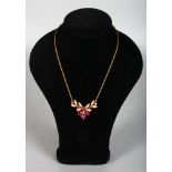 A LOVELY RUBY AND DIAMOND GOLD NECKLACE AND CHAIN.