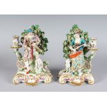 A SUPERB PAIR OF SAMSON "CHELSEA DERBY" SEATED BAGPIPER AND LADY CANDLESTICK GROUPS, the man with