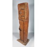 CARVED OUT OF THE SOLID. AN UNUSUAL TALL STANDING CUPBOARD, with two panel doors. 6ft high x 1ft