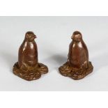 A SMALL PAIR OF CHINESE BRONZE PENGUINS.