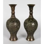 A PAIR OF CHINESE BRONZE PIERCED VASES. 10ins high.