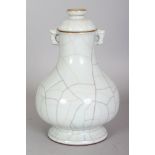 A CHINESE GE STYLE CRACKLEGLAZE PORCELAIN VASE & COVER, of archaic form, the base with five spur