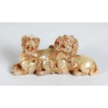 A SMALL CHINESE CARVED JADE OF TWO DOGS OF FOE. 3.25ins long.