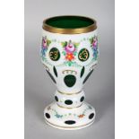 A BOHEMIAN WHITE OVER VASE painted with garlands of flowers. 6ins high.
