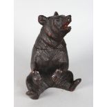 A BLACK FOREST CARVED WOOD BEAR TOBACCO JAR. 8ins high.