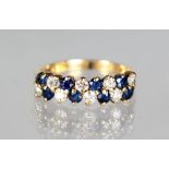 A 9CT GOLD DOUBLE ROW RING.