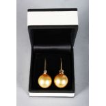 A PAIR OF YELLOW GOLD SOUTH SEA PEARL AND DIAMOND DROP EARRINGS.