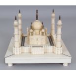 A 19TH/20TH CENTURY INDIAN SECTIONAL IVORY, EBONY & SANDALWOOD MODEL OF THE TAJ MAHAL, 6.9in