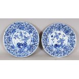 TWO SIMILARLY DECORATED CHINESE KANGXI PERIOD BLUE & WHITE PORCELAIN SAUCERS, circa 1700, with