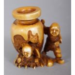 A SIGNED JAPANESE MEIJI PERIOD STAINED IVORY NETSUKE OF TWO BOYS & A WATER JAR, the subject from the