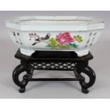 A CHINESE REPUBLIC PERIOD FAMILLE ROSE PORCELAIN JARDINIERE, together with a fitted wood stand,