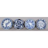 A GROUP OF FOUR 19TH CENTURY CHINESE KANGXI STYLE PORCELAIN SAUCERS, the largest 5.2in diameter. (