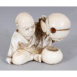 A SIGNED JAPANESE MEIJI PERIOD IVORY NETSUKE OF A YOUNG MONK, holding aloft a temple bell and with a