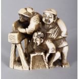 A JAPANESE MEIJI PERIOD TRIANGULAR SECTION IVORY NETSUKE OF FARMERS THRESHING RICE, of larger than