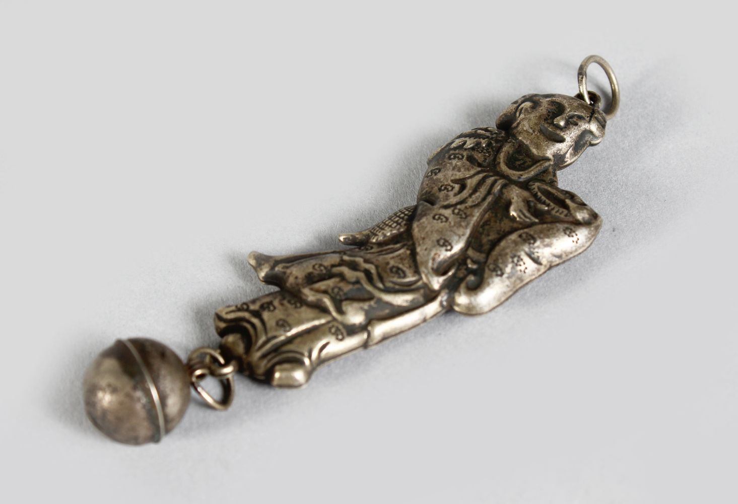 A CHINESE SILVER FIGURE OF A LADY as a rattle.