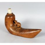 A VERY UNUSUAL CARVED WOOD MOUSE EATING INTO A DUTCH SHOE formed as a candlestick. 12.5ins long x