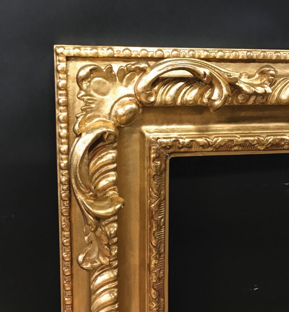 20th- 21st Century English School Style. A Carved Gilt Swept and Pierced Corners Frame, 30.25" x