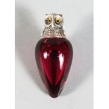 A SMALL CRANBERRY GLASS PEAR SHAPE SCENT BOTTLE, the silver screw top modelled as an owl. 2ins